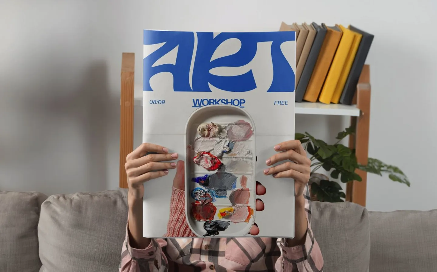 Woman reading art newspaper